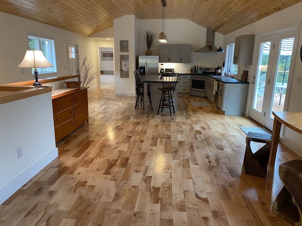 View from the other end of the room, looking at the kitchen.