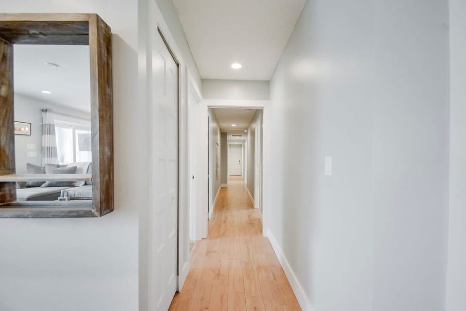 Hallway from living area looking down towards bedrooms and bathrooms.