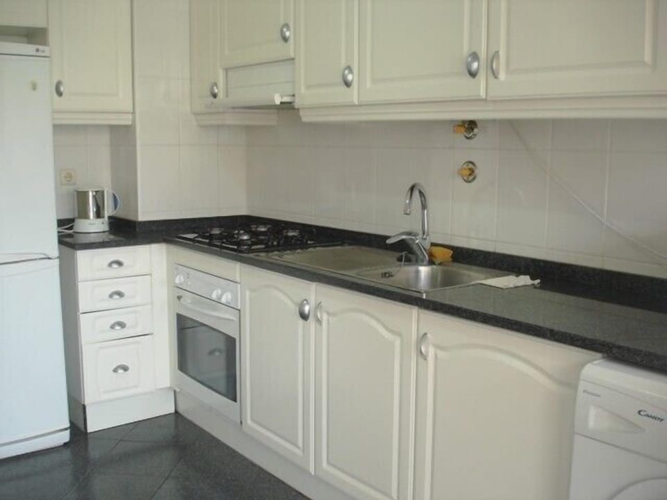Kitchen,  table, chairs door to balcony sea view