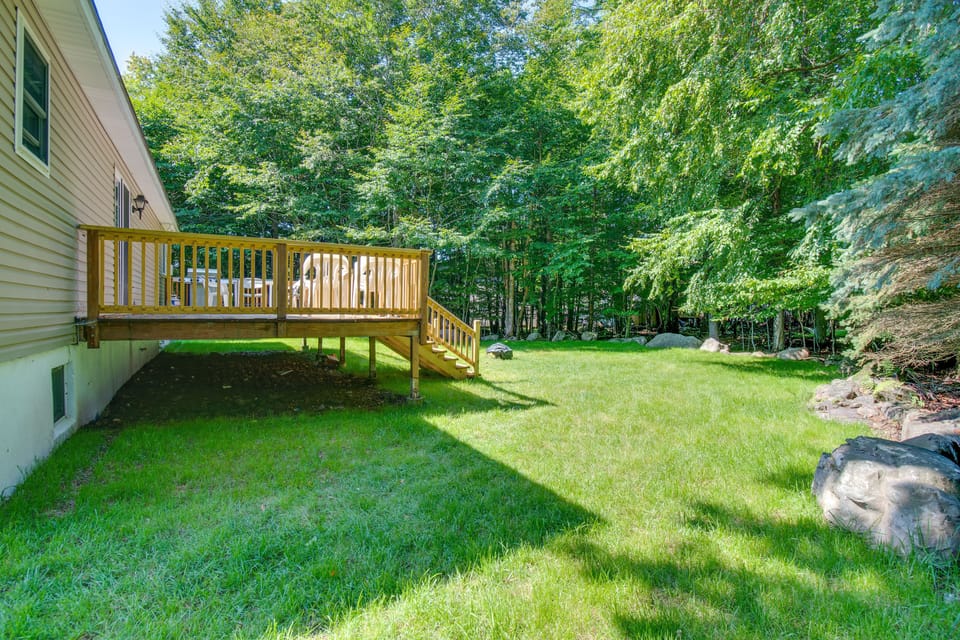 Ample size backyard with fire pit 