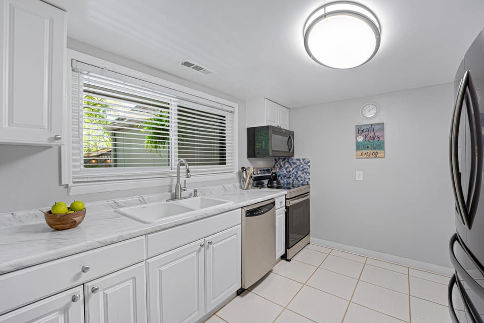 The kitchen is bright and inviting, designed for easy vacation living.  Everything you need is right at hand for comfortable, carefree stays.
