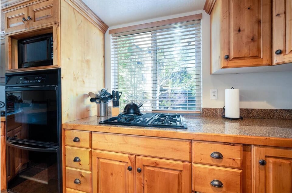 Cook your favorite meals in a kitchen bathed in natural light that enhance the culinary experience.