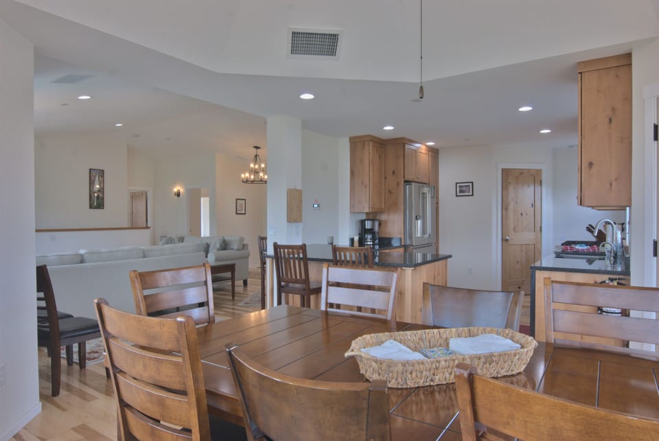 The living room, kitchen and dining areas all form one large open space