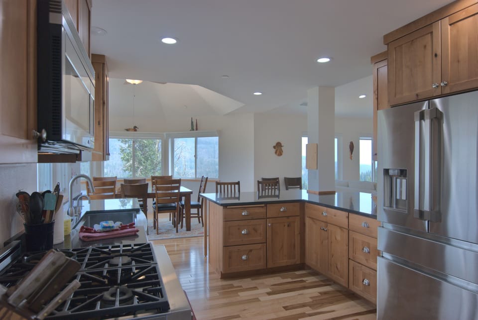 Our kitchen features a large refrigerator and high-end gas range