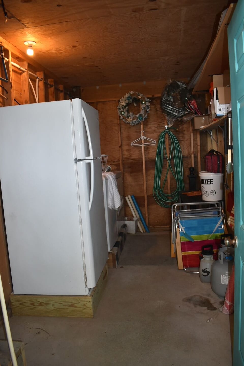 Laundry room/extra fridge/misc beach supplies (beach chairs and coolers)