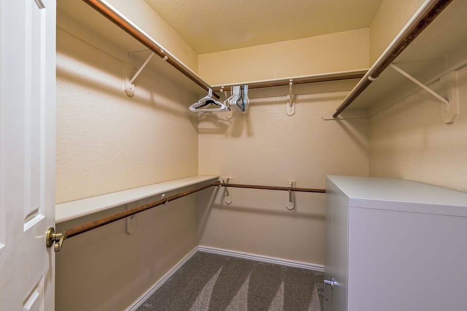 Upstairs master bedroom walk in closet.