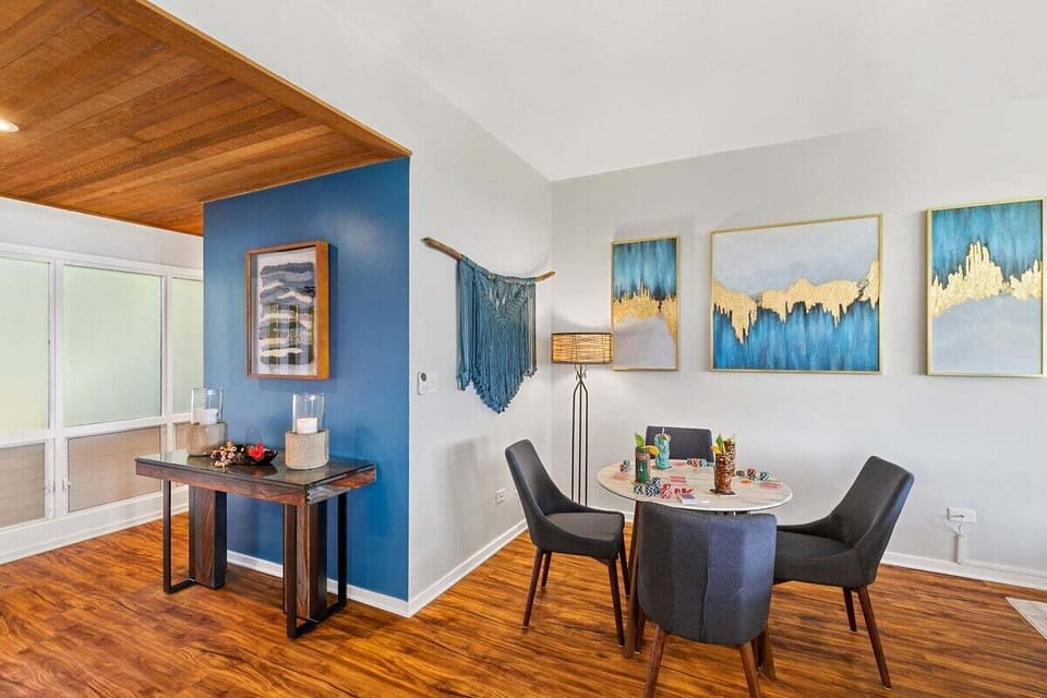 Cozy common area with desk workspace and coastal décor accents.