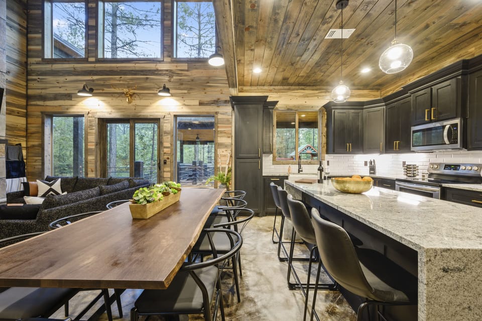 Large 10 seat dining table and island with ample seating for meals.