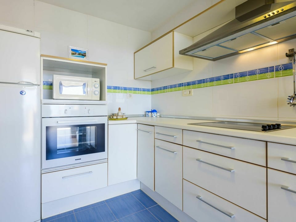 Cabinetry, Countertop, Tap, Furniture, Kitchen Appliance, Building, Kitchen Stove, Kitchen, Drawer, Home Appliance