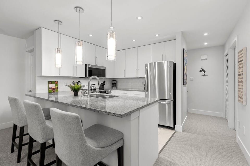 Enjoy cooking in this spacious, contemporary kitchen. Equipped with stainless steel appliances and granite counters!
