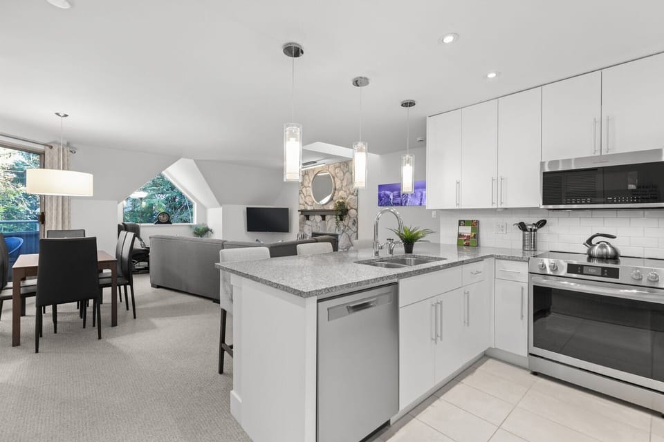 The open kitchen makes preparing meals a breeze while staying connected to the family.