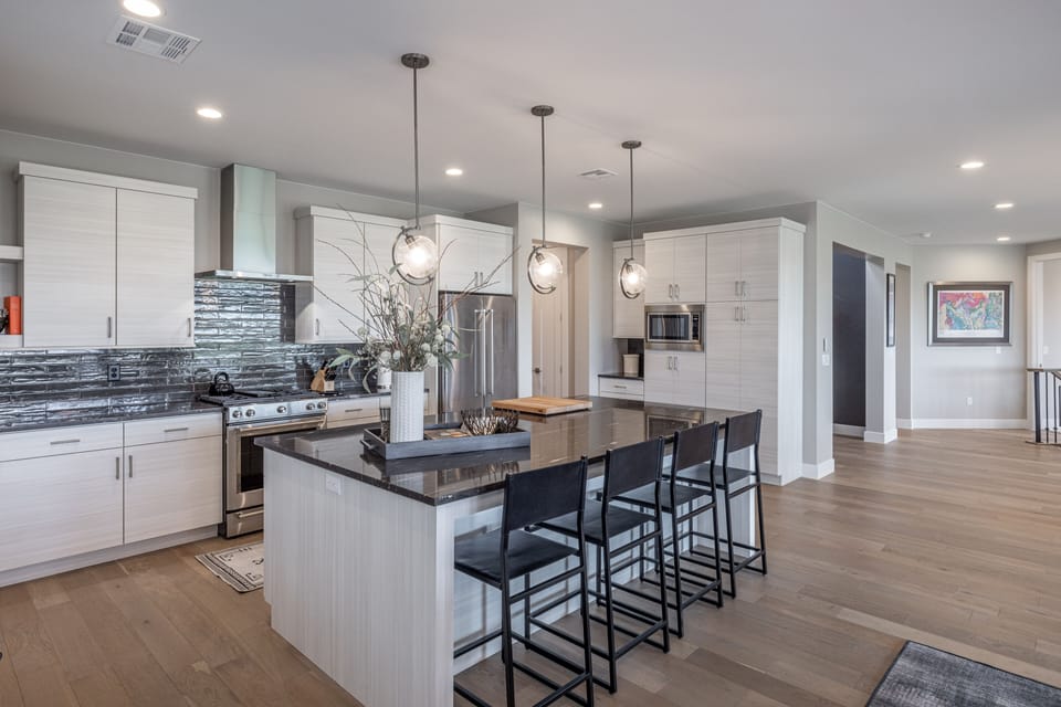 Kitchen - The kitchen is fully stocked with all the dishes, cookware, baking pans, and cutlery you will need for meal preparations and includes stainless steel appliances and granite counter tops.