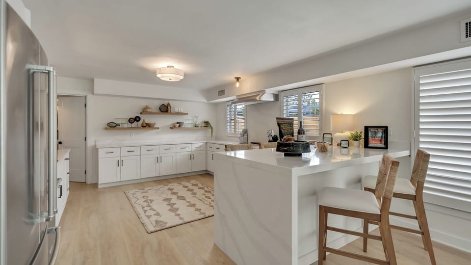 Spacious open kitchen with bar seating