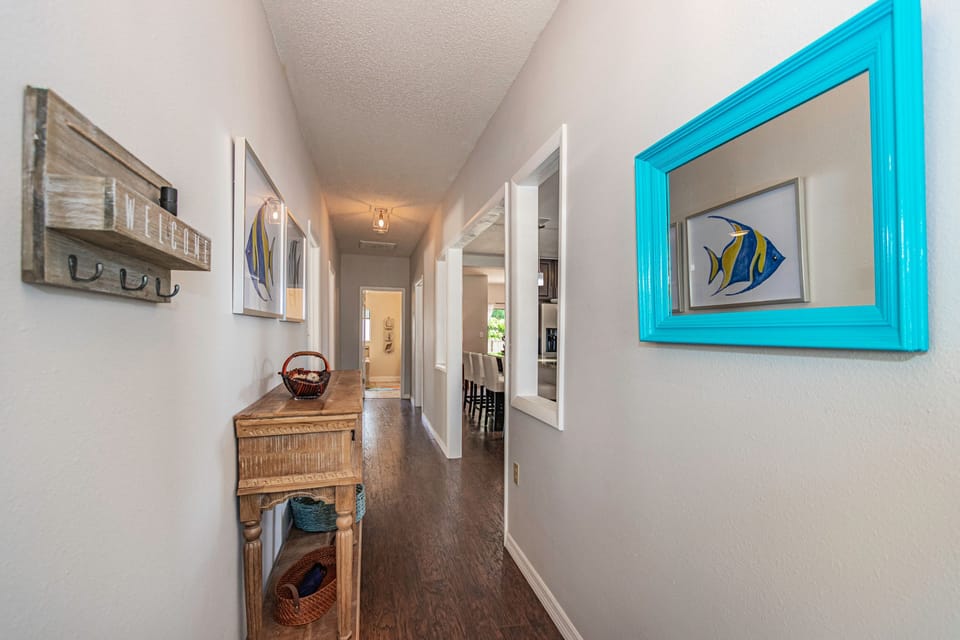 Hallway - bedrooms to left, living areas to right.