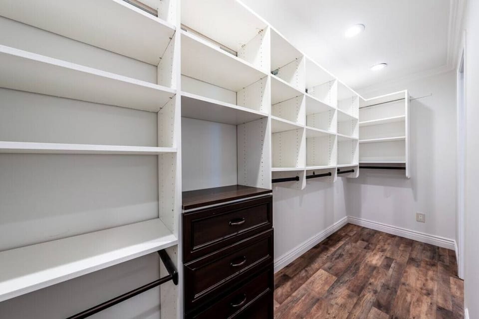 Walk in closet across the hall from the master bathroom.