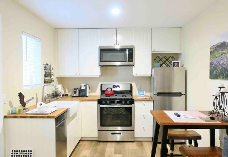 Full kitchen with stainless steel appliances.