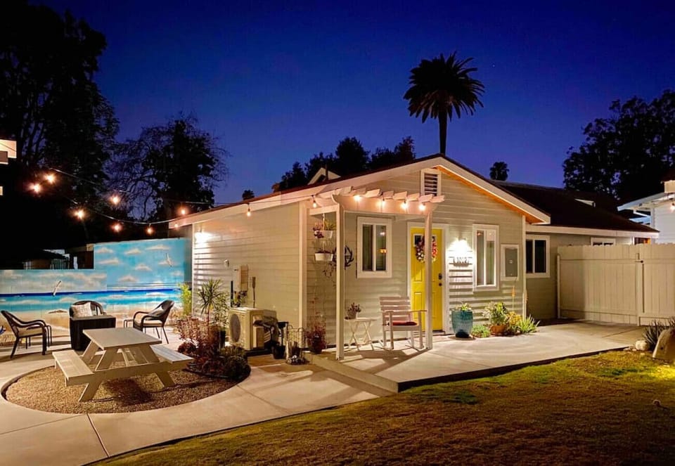 Side patio has firepit that is shared between 3 houses on the lot.