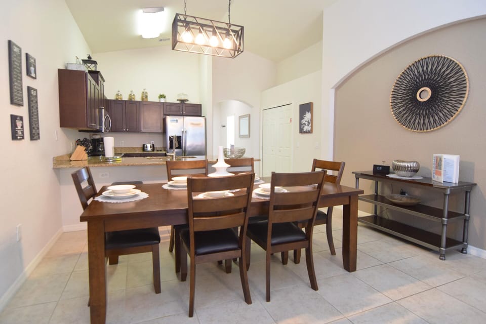 Formal dining area to seat six next to the breakfast bar with two stools