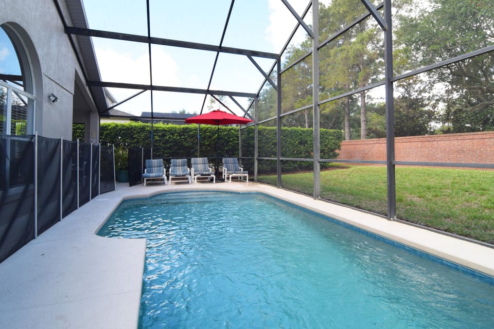 Private west-facing pool, no rear neighbors, loungers, dining area, lawn area