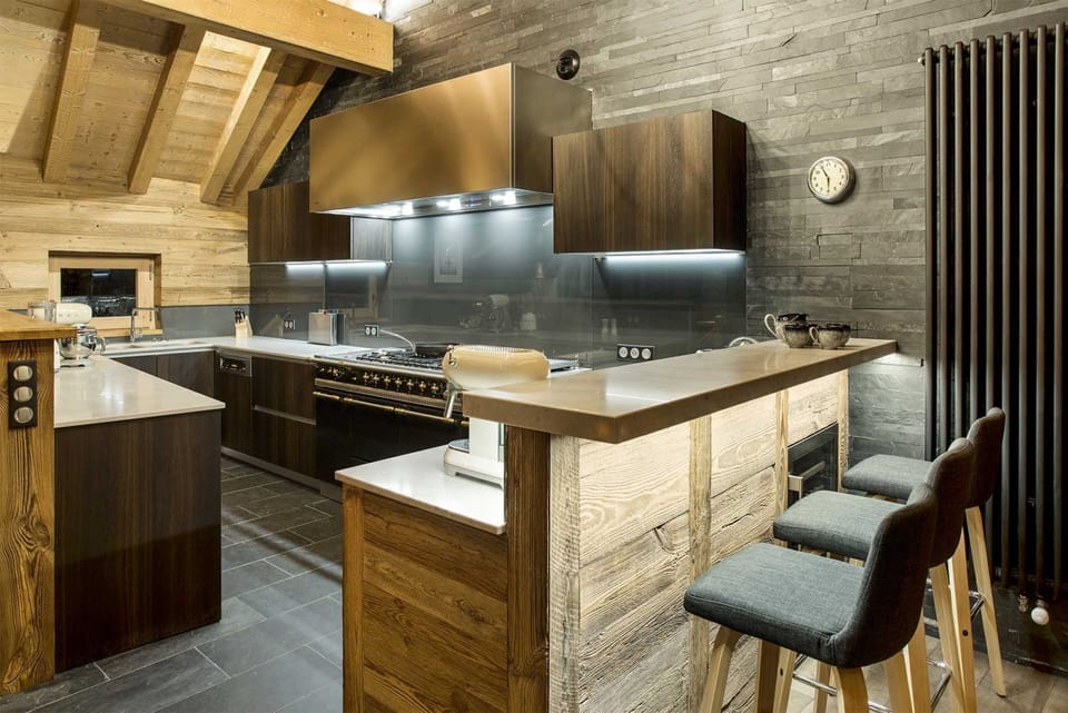 Well-appointed kitchen with wooden cabinetry and everything you need to cook for a group