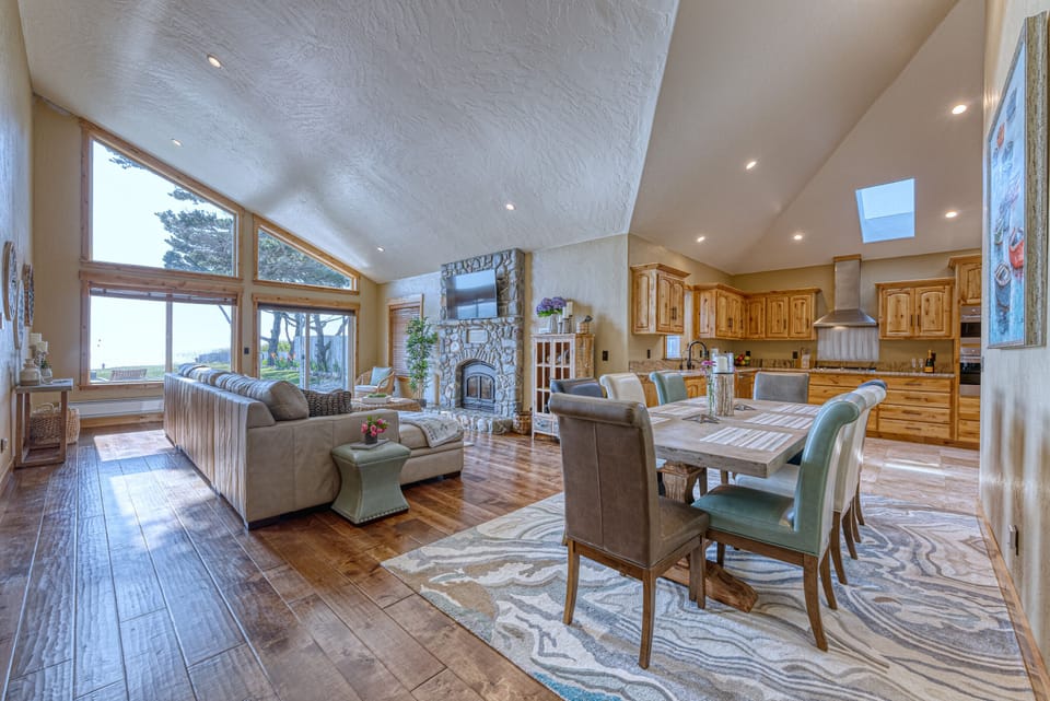 Open space Livingroom, dining area and kitchen.  Amazing views and fireplace.