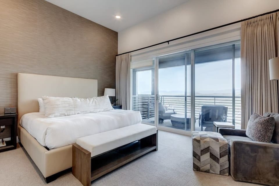 King Master Bedroom (Upper Level) with en-suite master bath, fireplace, deck with incredible valley and Uinta mountain views