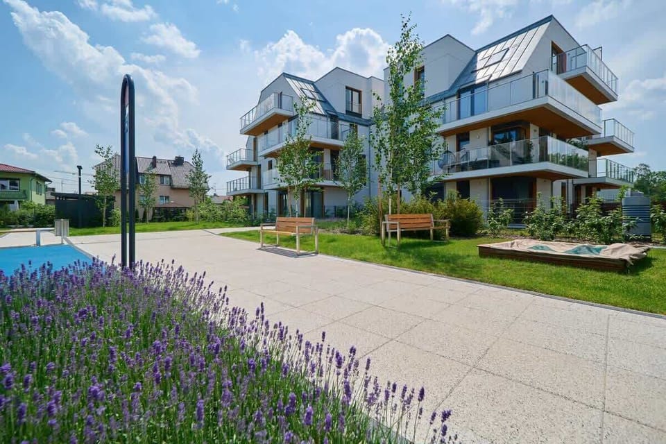 Another angle of the landscaped property, capturing its modern architecture and greenery.