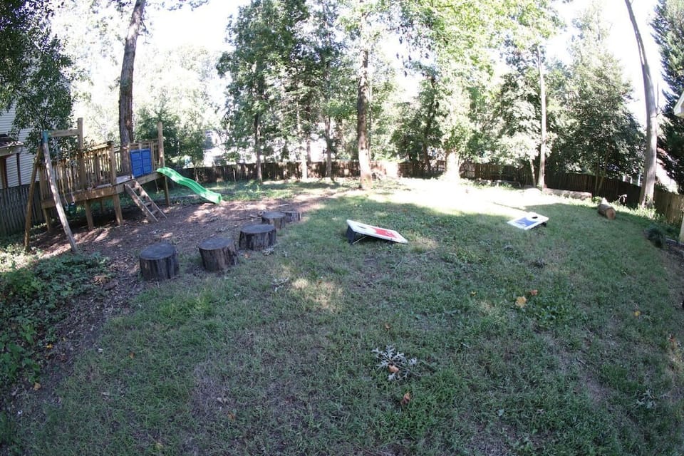 Fully Fenced backyard with play area and swing