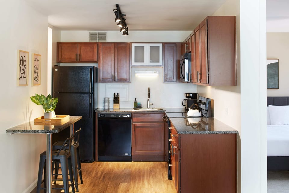 Fully stocked kitchen with 2 counter stools and everything you need to make a great meal