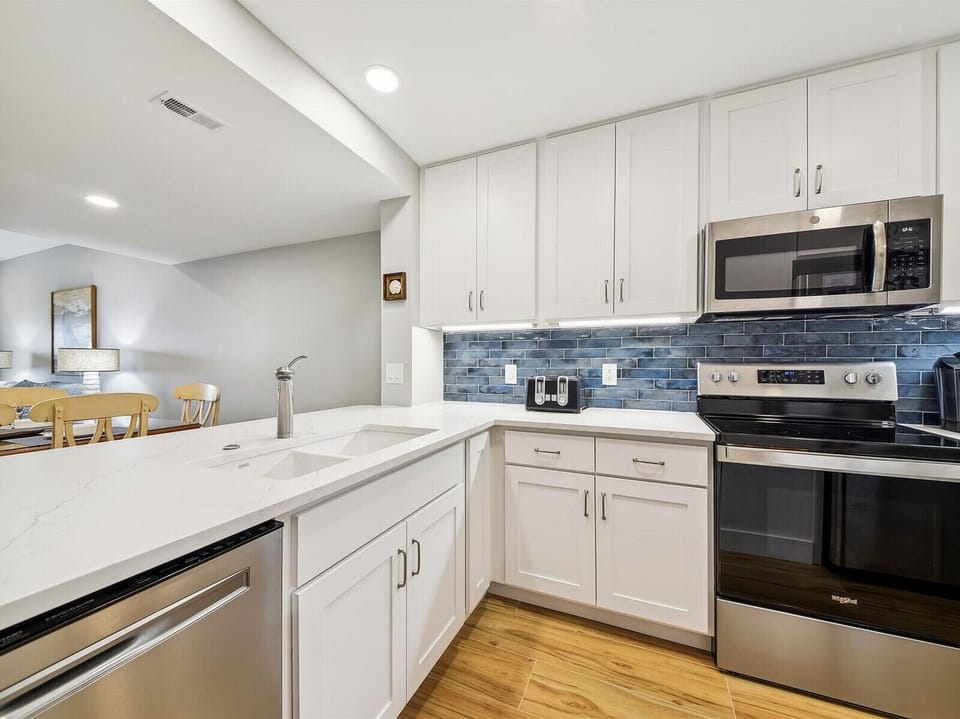Renovated Kitchen with Stainless Steel Appliances at 472 Captains Walk