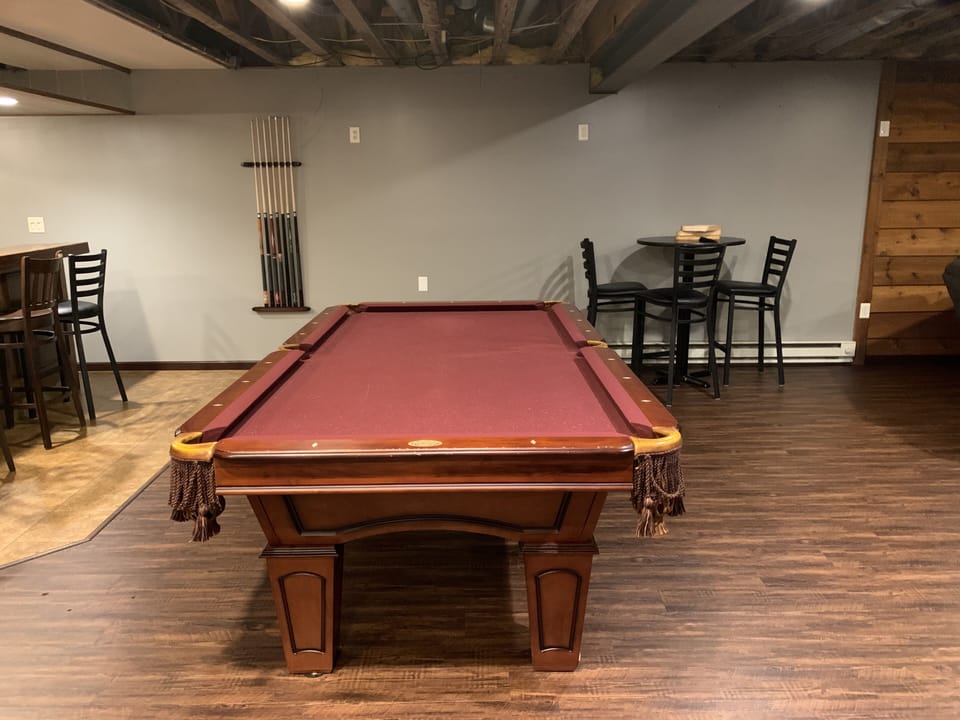 Pool table by basement bar