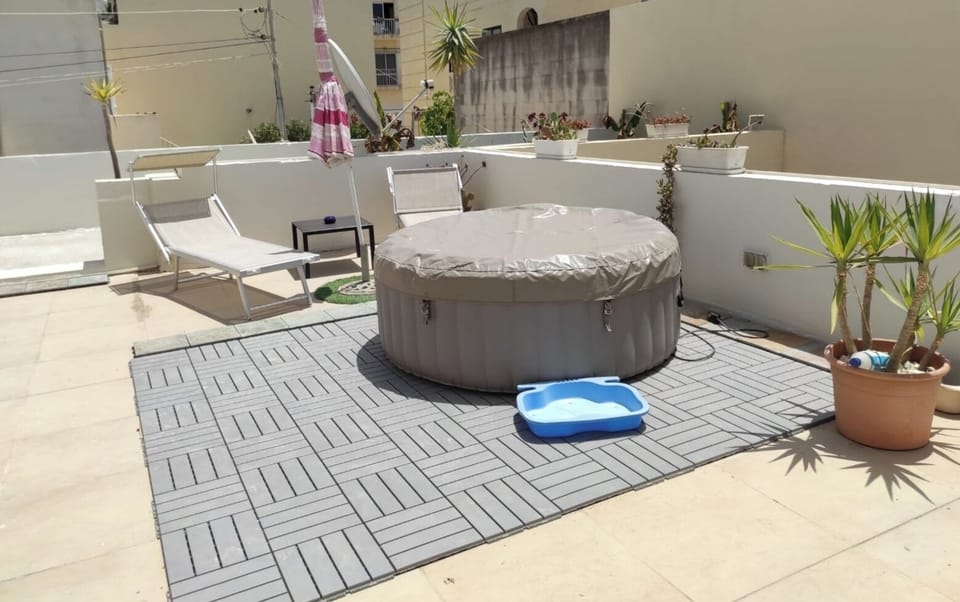 Your own private terrace with jacuzzi.  With dechairs umbrella and roof garden. 