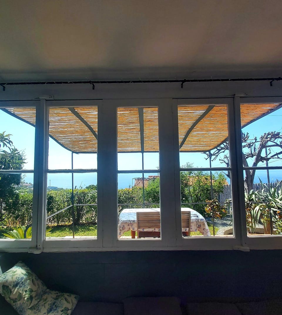 Large windows look over the gardens with sea views