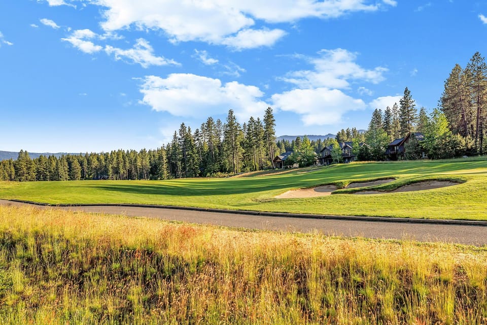 An oasis of relaxation awaits in this high-end mountain home overlooks hole 12 on Rope Rider