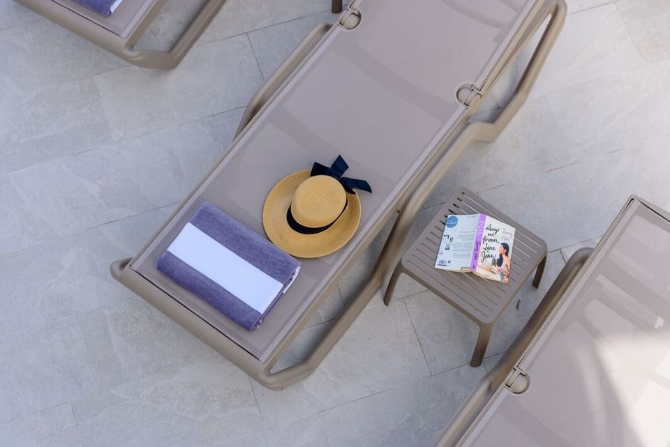 Deck chairs by the private pool of a Croatia luxury family villa Asteria with gym and sauna in Trogir
