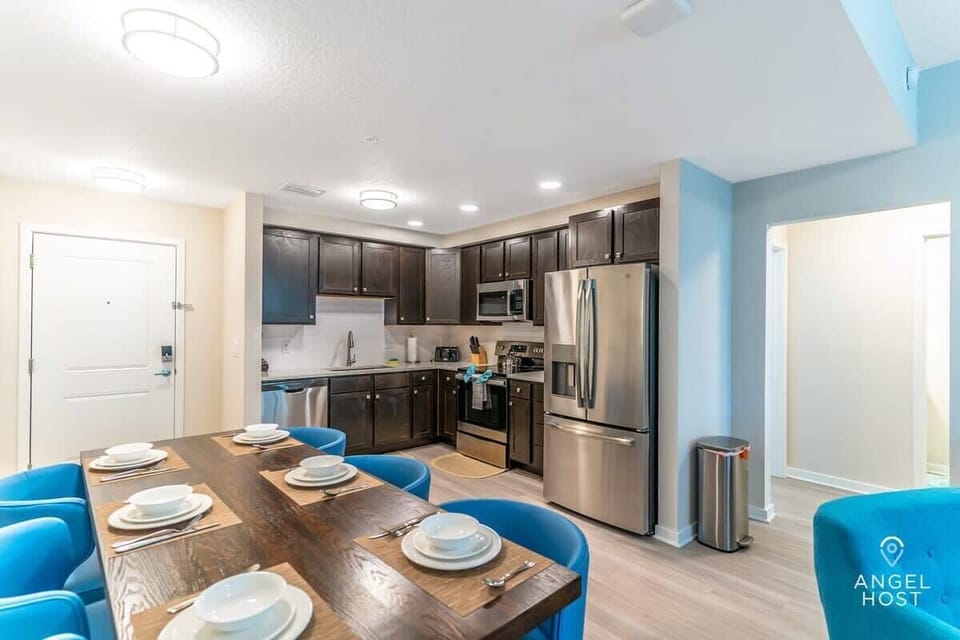 Your vacation condo awaits, featuring a lovely dining and kitchen space.
