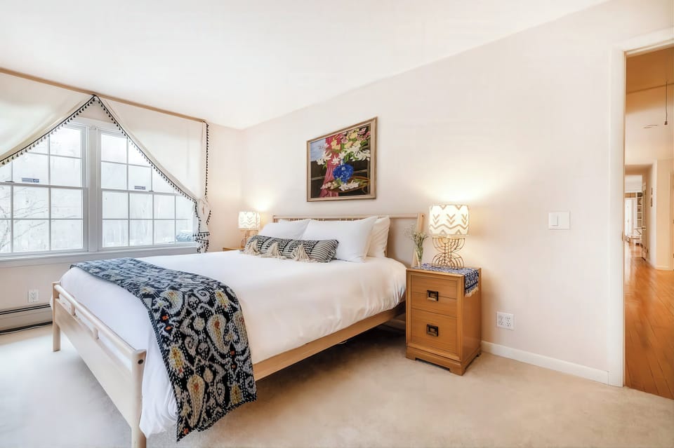 Primary bedroom with King bed and views of the river.