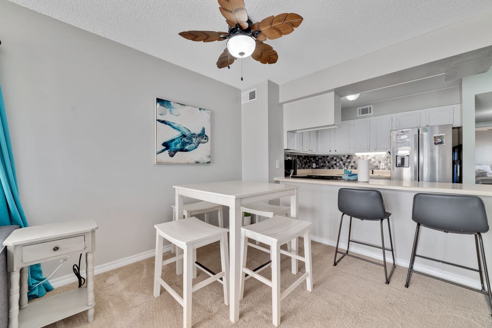 Dining table with four chairs along with two bar stools