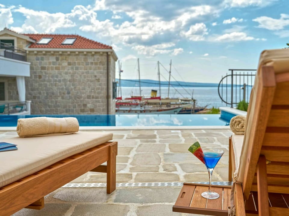 Cloud, Sky, Water, Building, Furniture, Azure, Wood, Outdoor Furniture, Shade, Interior Design