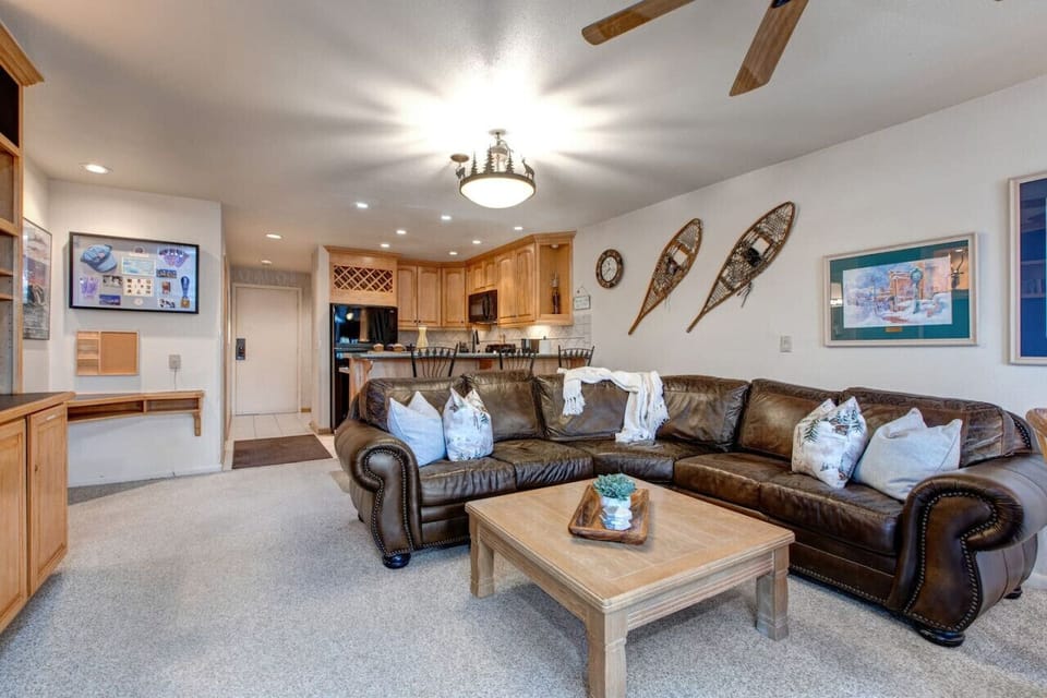 Cozy up fireside on the oversized leather sofa – mountain lounging at its finest