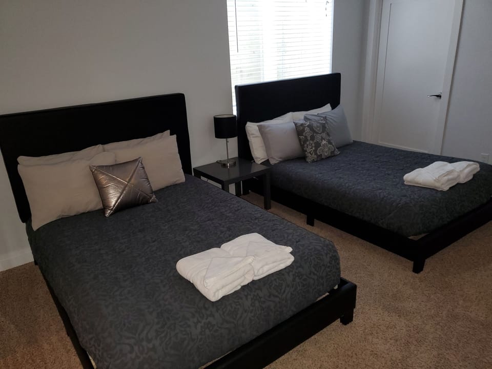 Basement bedroom with 2 full beds