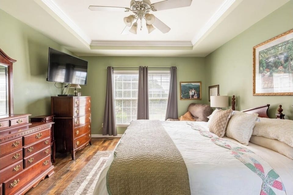 Master downstairs bedroom 1 King Bed. Private full bathroom with walk-in shower 
