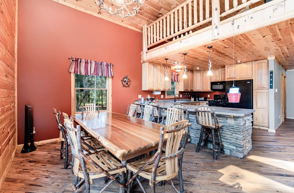 Dining area with 8 table seats and 4 barstools