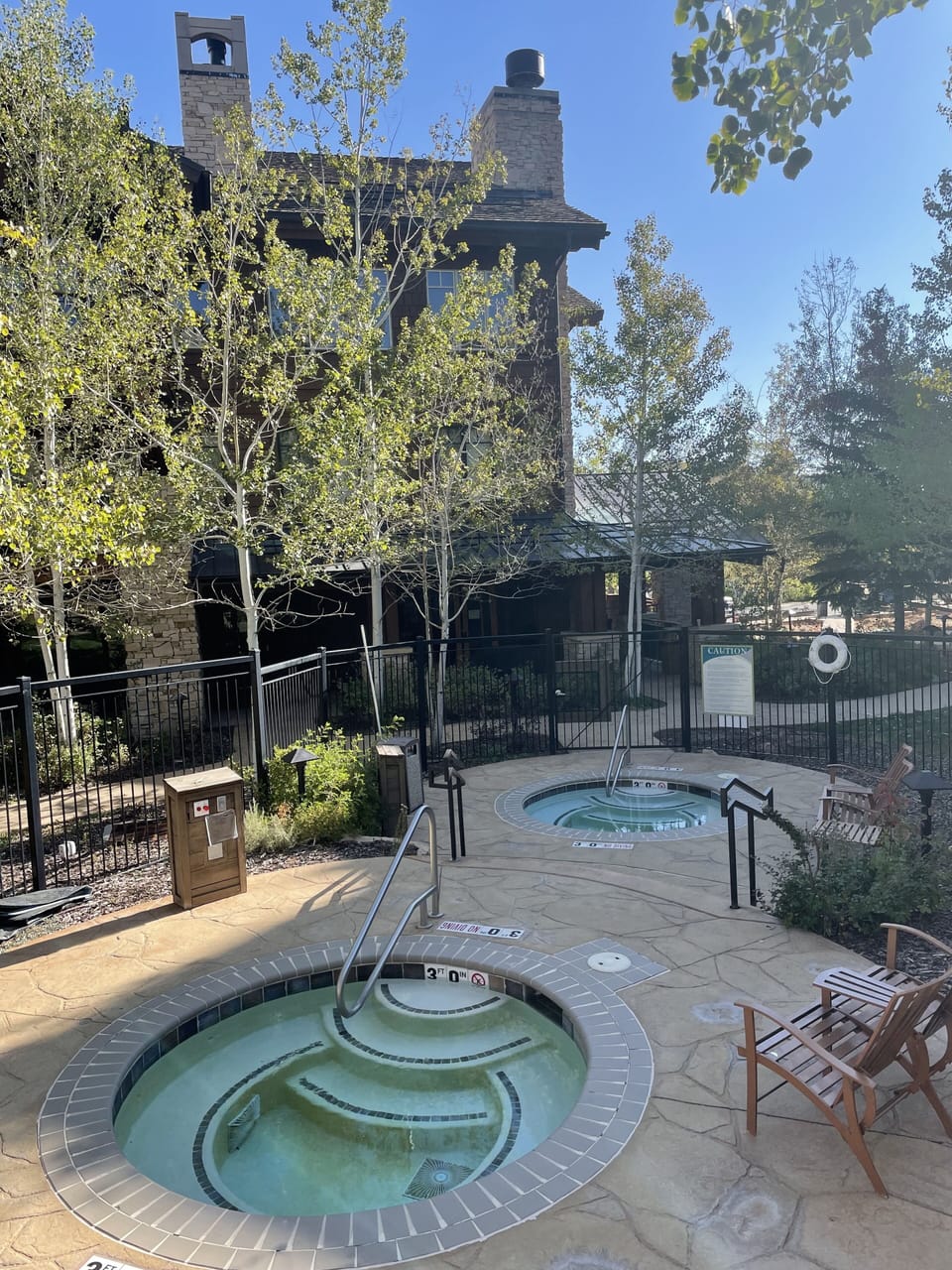 The inviting hot tubs are located next to the slope, but still offer privacy.