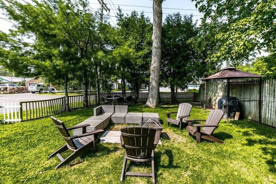 A cozy backyard oasis, perfect for relaxing with friends and family on a warm evening.