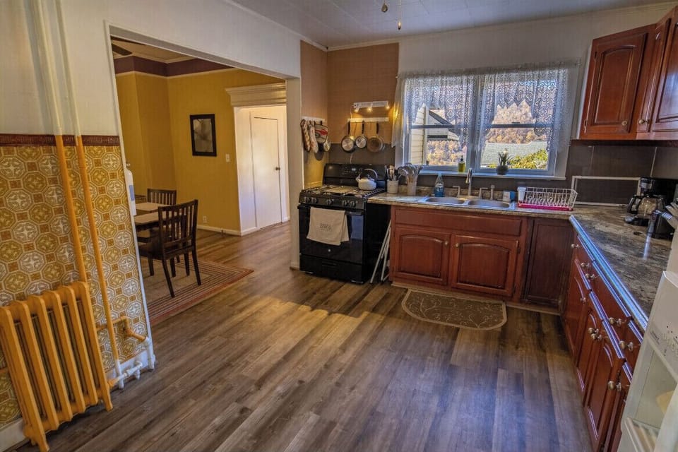 Alternate view of kitchen leading into dining room