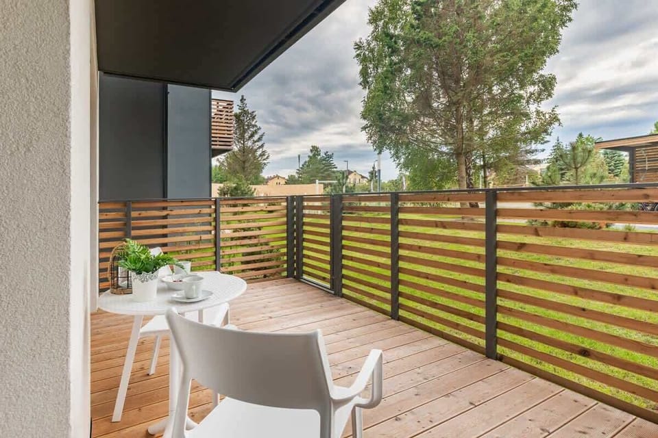 The terrace's stylish design complements the apartment's decor. 