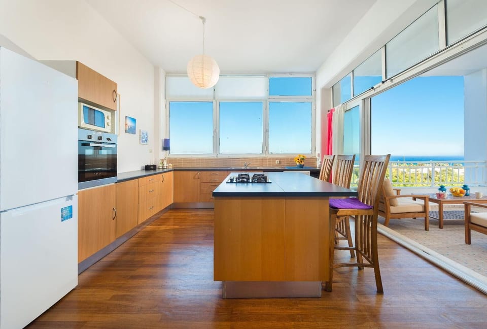 Kitchen area. Fully equipped open kitchen with access to there balcony