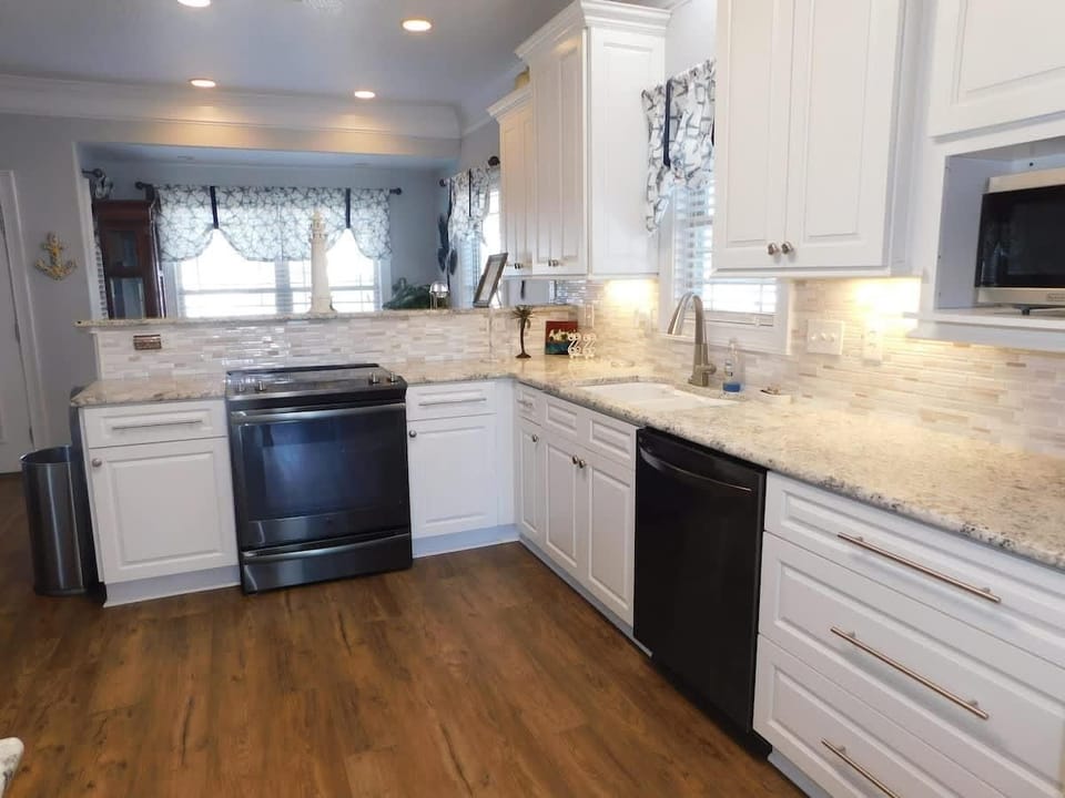 Bright, modern kitchen with spacious countertops and sleek appliances