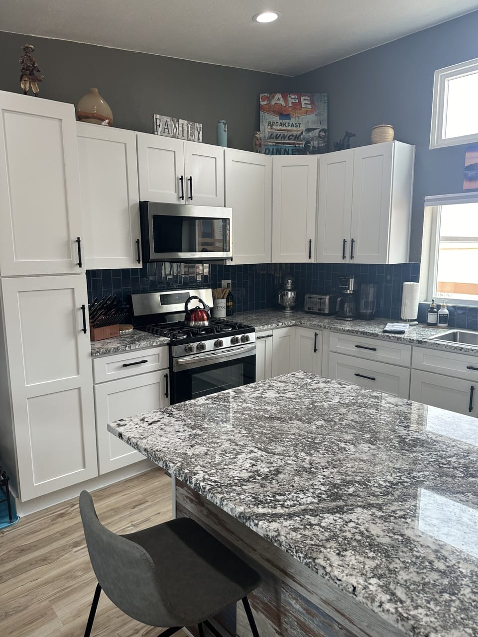 Newly remodeled kitchen with gas oven and microwave